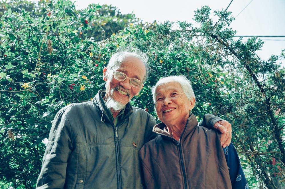 old man and woman smiling